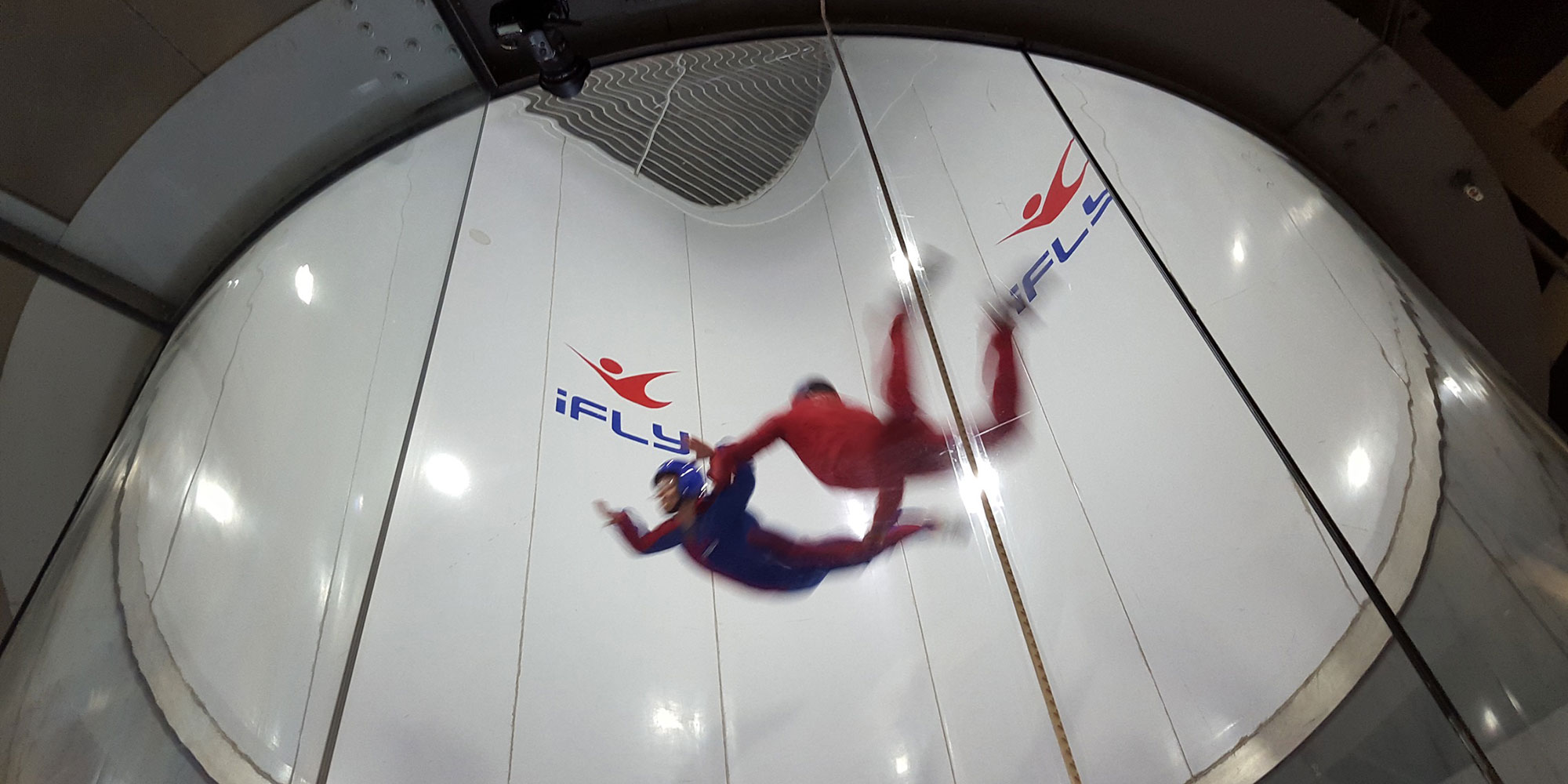 two people in a indoor skydiving facility