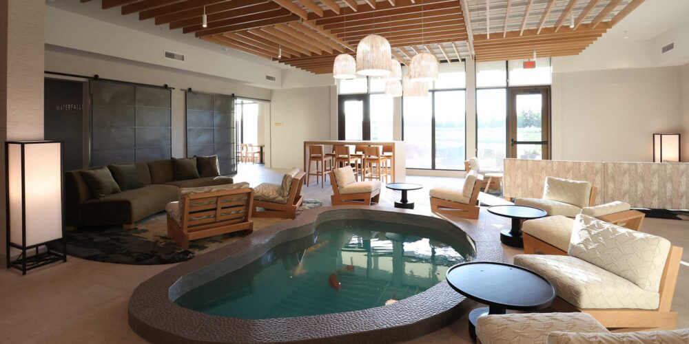 tranquil lobby in a hotel with a pond with koi