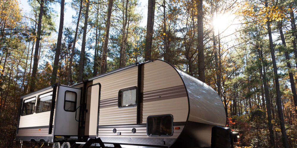 trailer camping in a wooded area