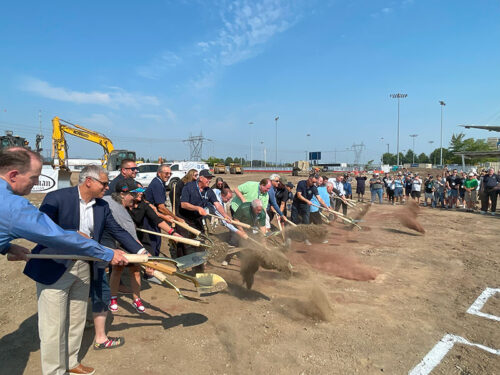 group shoveling dirt