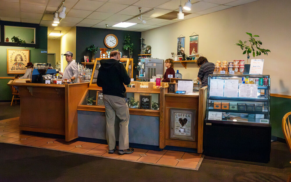 person order coffee at counter